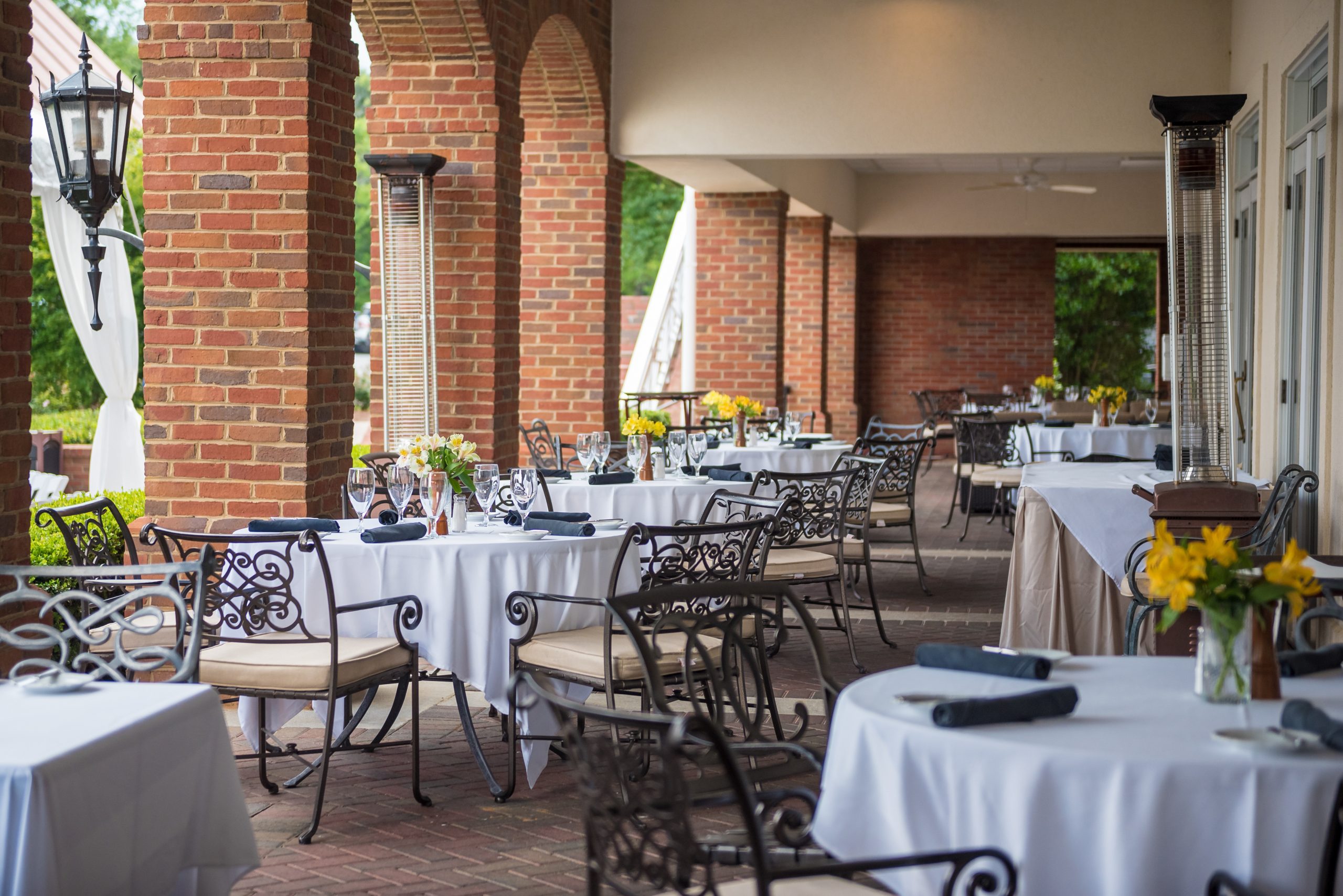Outdoor restaurant with tables set for a wedding celebration in Marietta, Georgia, the US